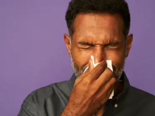 A man blowing his nose