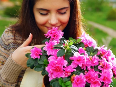 A woman smelling flowers