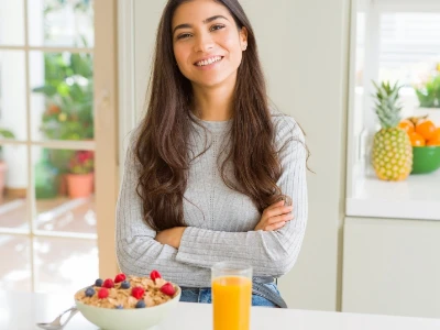 Woman in kitchen smiling 