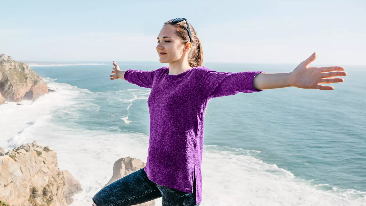 Women confidently balancing on the beach