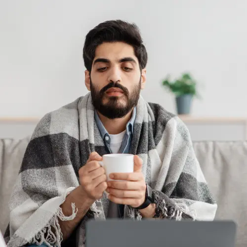 Man drinking hot beverage