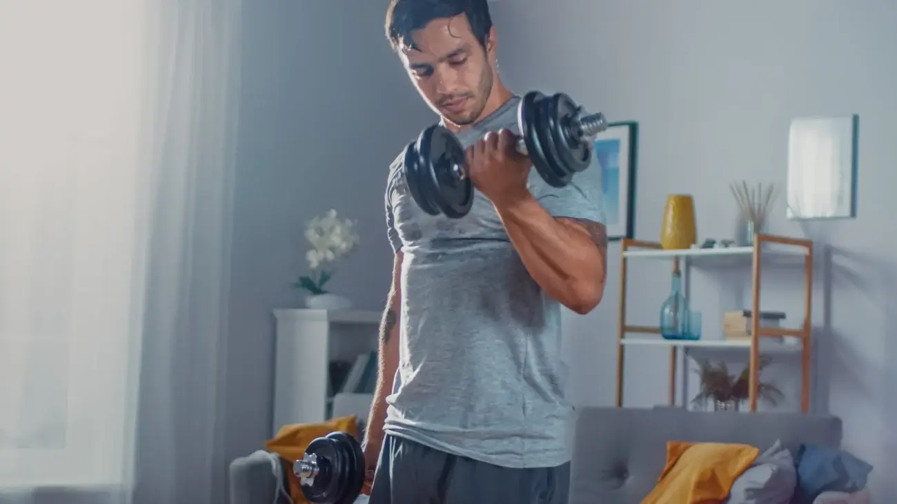 A man playing sports in his room