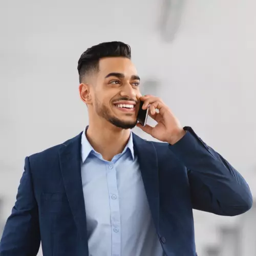 Man confidently talking on the phone